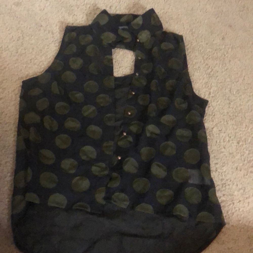 A see-through button up poke-dot